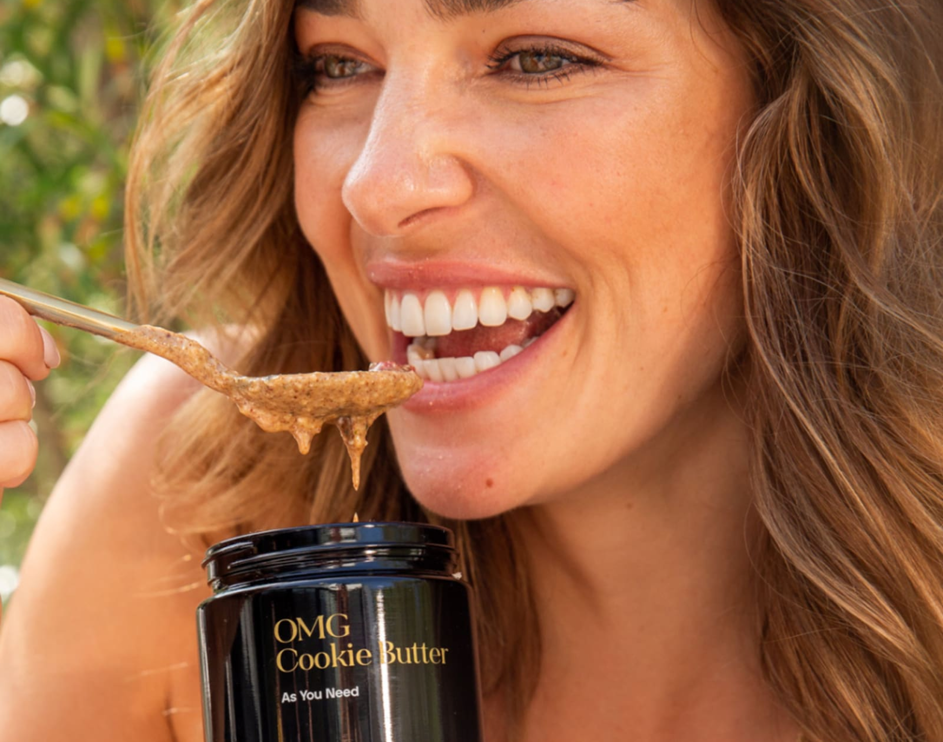A woman with cookie butter product.